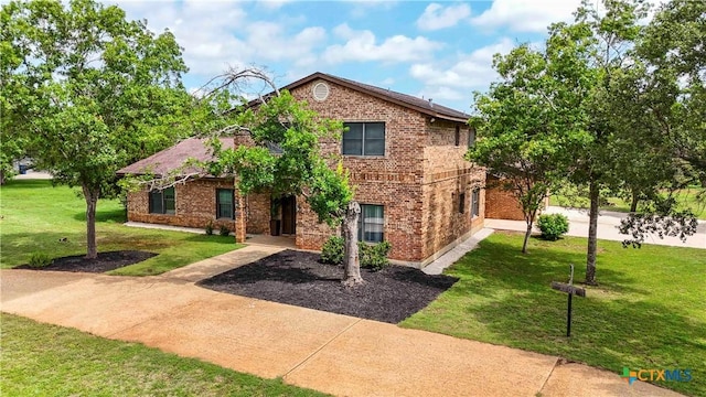 2406 Northwoods Dr, New Braunfels, TX 78132 - traditional home with brick siding and a front yard