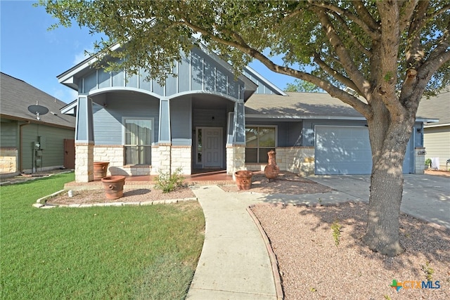 view of front of property featuring a garage and a front yard