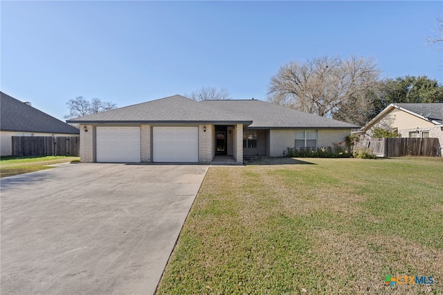 single story home with a front yard and a garage