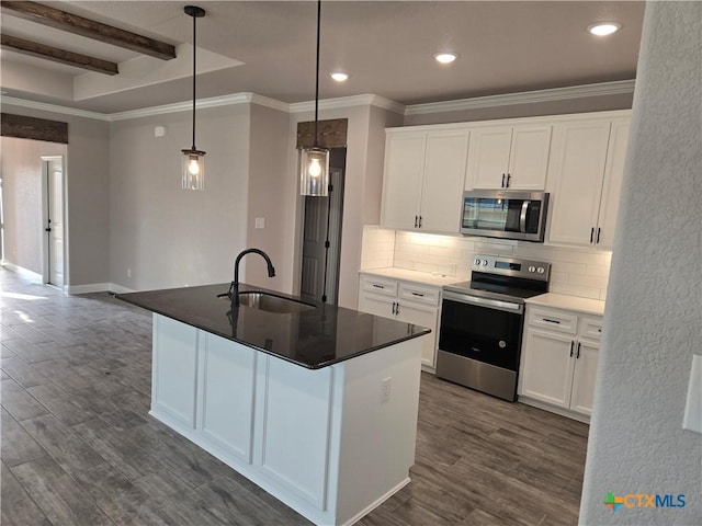 kitchen featuring decorative backsplash, appliances with stainless steel finishes, dark wood-style flooring, and a sink