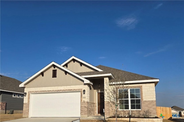 view of front facade featuring a garage, roof with shingles, concrete driveway, and brick siding