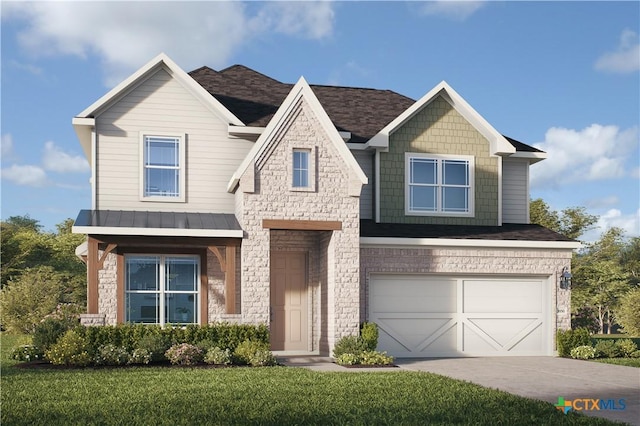 view of front of house featuring a front yard and a garage