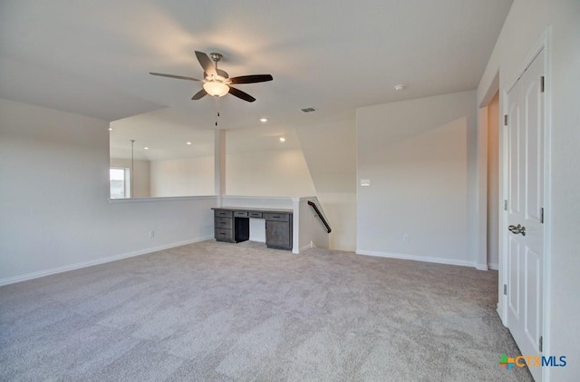 unfurnished living room with light carpet and ceiling fan