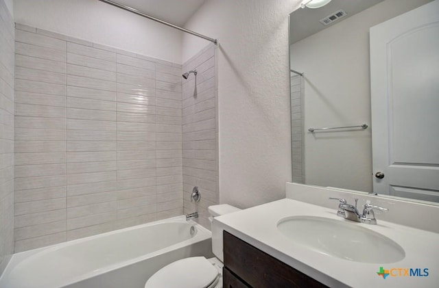 full bathroom featuring toilet, vanity, and shower / washtub combination