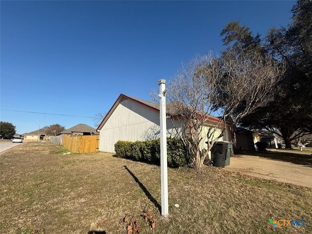 view of property exterior featuring a yard