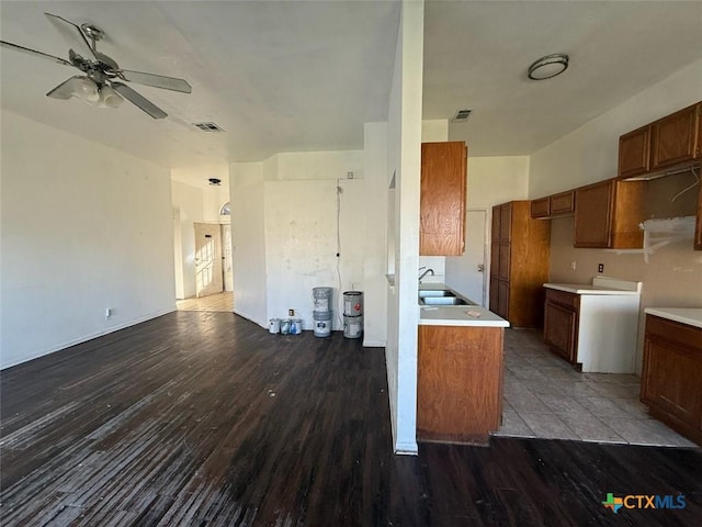 kitchen featuring hardwood / wood-style flooring, sink, and ceiling fan