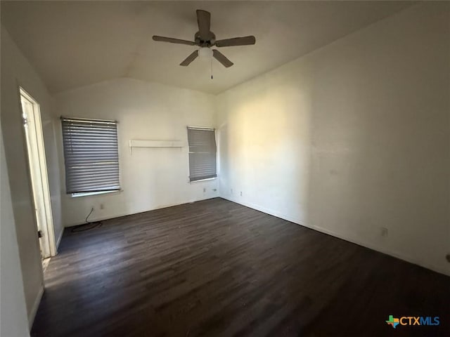 unfurnished bedroom with ceiling fan, dark hardwood / wood-style flooring, and lofted ceiling