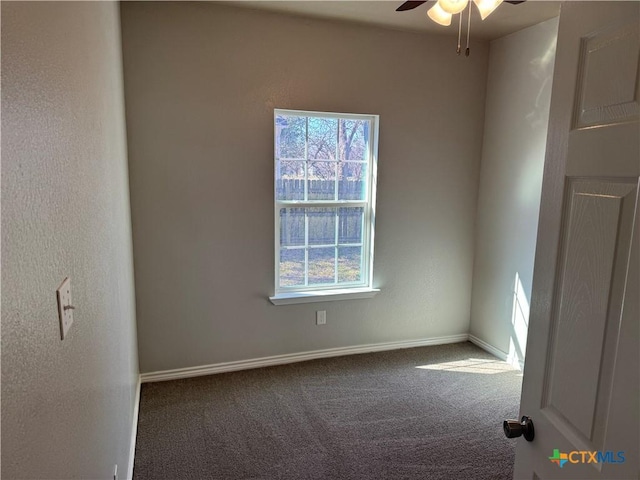 unfurnished room featuring baseboards, a ceiling fan, and carpet flooring