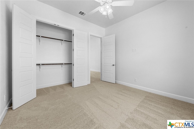 unfurnished bedroom with ceiling fan, a closet, and carpet floors