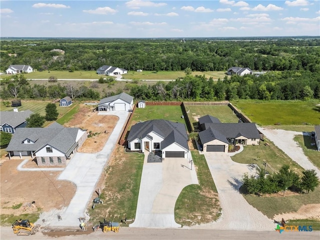 bird's eye view featuring a view of trees and a residential view