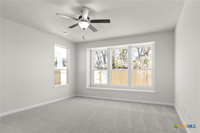 carpeted empty room with ceiling fan