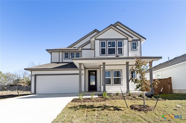 view of front of house with a garage and a front lawn