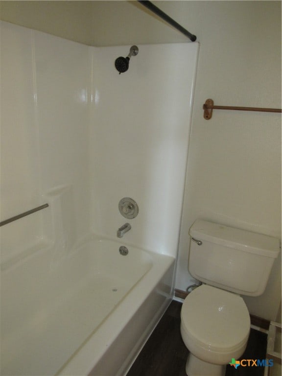 bathroom with shower / tub combination and toilet