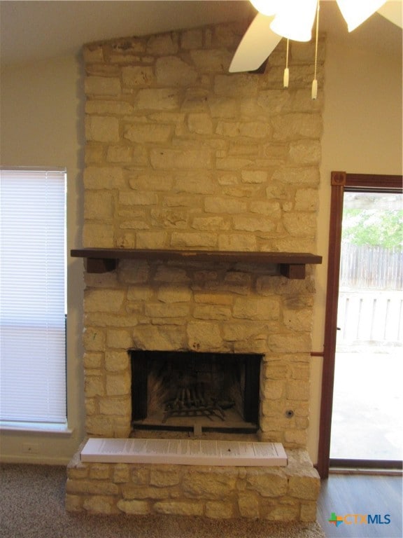 details with a fireplace and ceiling fan