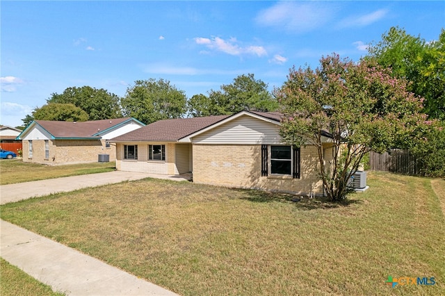 ranch-style house with central AC and a front lawn