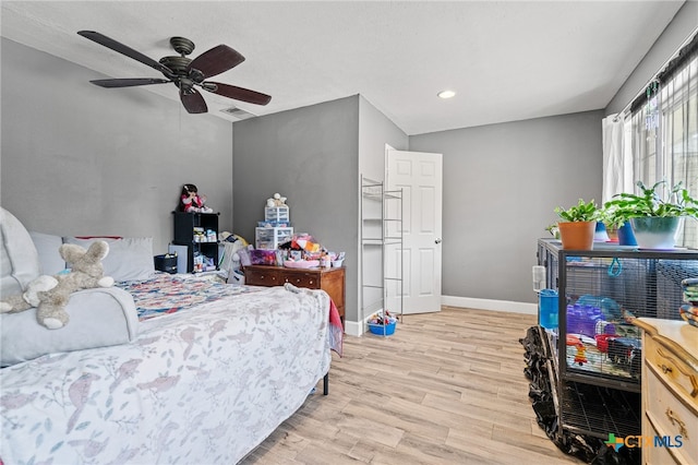 bedroom featuring light hardwood / wood-style floors and ceiling fan