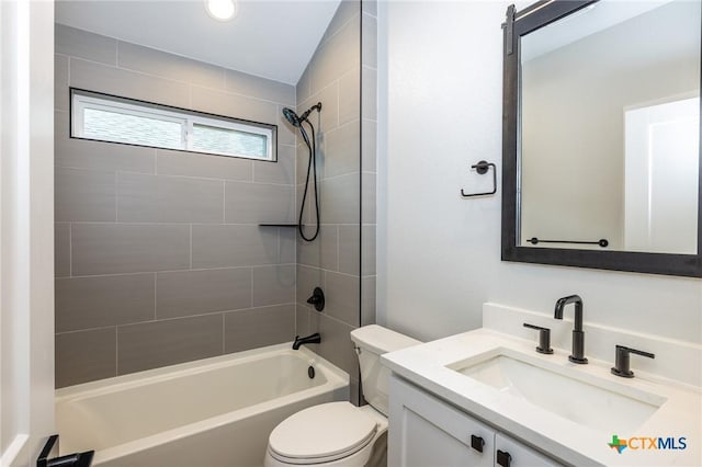 full bathroom featuring vanity, toilet, and tiled shower / bath combo