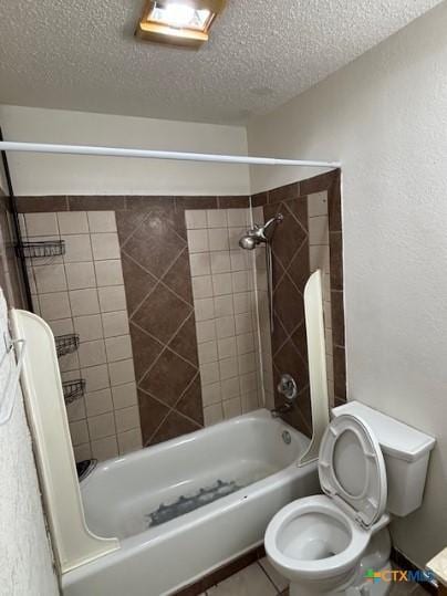 3206 Tallwood Dr, Killeen, TX 76549 - bathroom featuring a textured ceiling, washtub / shower combination, and tile patterned floors