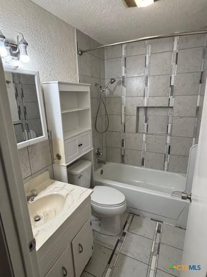 3206 Tallwood Dr, Killeen, TX 76549 - bathroom with a textured ceiling, a textured wall, vanity, and shower / tub combination