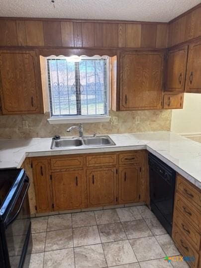 3206 Tallwood Dr, Killeen, TX 76549 - kitchen featuring black appliances, a textured ceiling, light countertops, brown cabinetry, and tasteful backsplash