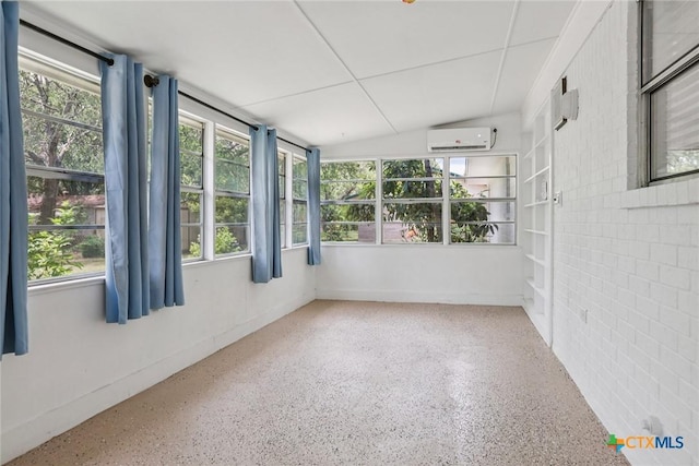 1334 Carnation Ln, New Braunfels, TX 78130 - unfurnished sunroom featuring vaulted ceiling, plenty of natural light, brick wall, speckled floor, and a wall mounted AC