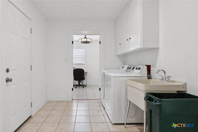 1334 Carnation Ln, New Braunfels, TX 78130 - washroom with cabinet space, separate washer and dryer, light tile patterned floors, and an office area
