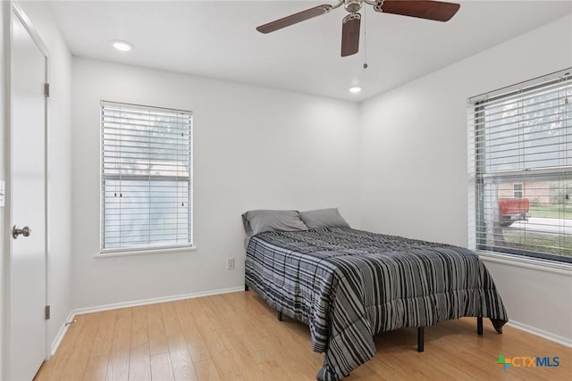 1334 Carnation Ln, New Braunfels, TX 78130 - bedroom with wood finished floors, ceiling fan, and recessed lighting