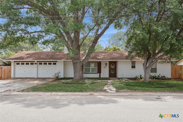1334 Carnation Ln, New Braunfels, TX 78130 - ranch-style home with an attached garage and driveway