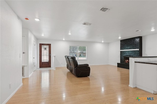 1334 Carnation Ln, New Braunfels, TX 78130 - foyer with light wood-type flooring, recessed lighting, and a fireplace