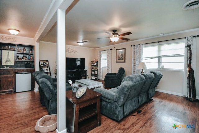 2303 Terrace Ave, Victoria, TX 77901 - living area featuring a bar, wood finished floors, and crown molding