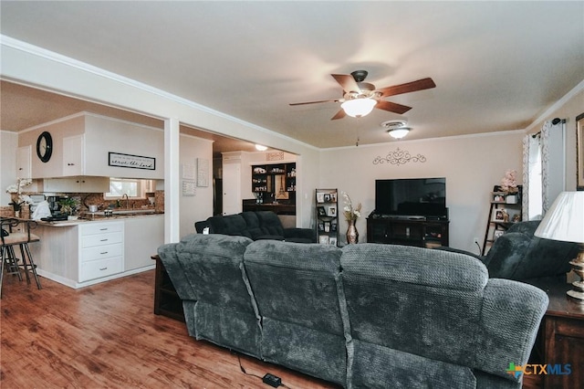 2303 Terrace Ave, Victoria, TX 77901 - living area featuring crown molding, ceiling fan, and wood finished floors