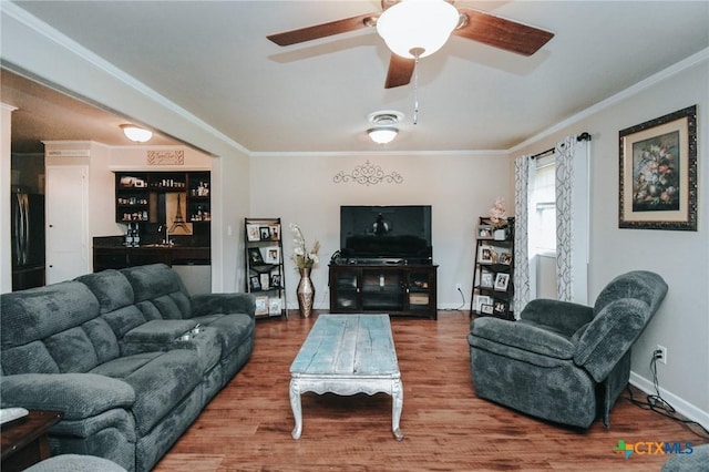 2303 Terrace Ave, Victoria, TX 77901 - living room with a ceiling fan, baseboards, crown molding, and wood finished floors