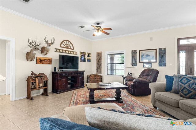 living room featuring light tile patterned flooring, ceiling fan, and ornamental molding