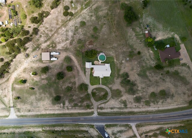 birds eye view of property featuring a rural view