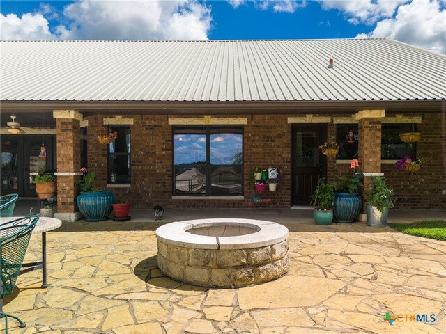 view of patio / terrace with an outdoor fire pit