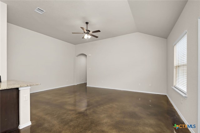 unfurnished living room featuring lofted ceiling and ceiling fan