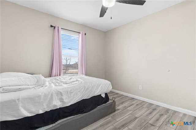 bedroom featuring ceiling fan and light hardwood / wood-style floors