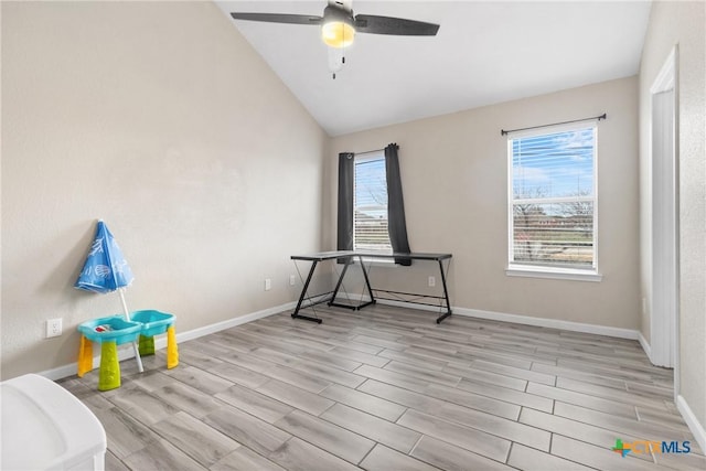 playroom with lofted ceiling, ceiling fan, and light wood-type flooring