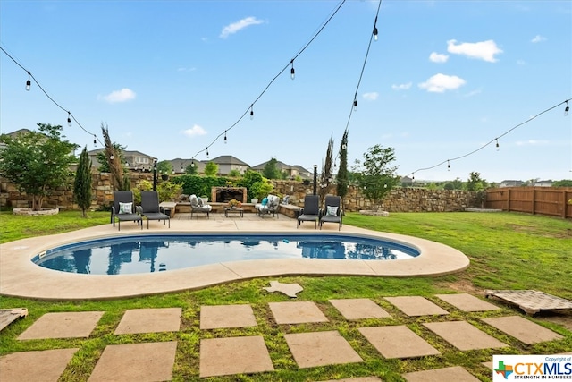 view of pool featuring a patio and a yard