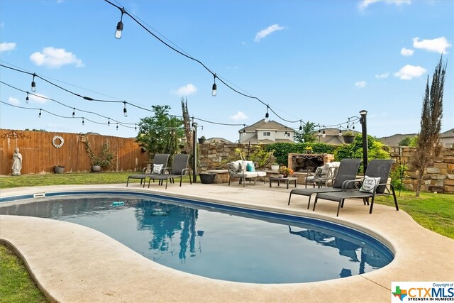 view of pool featuring a patio area