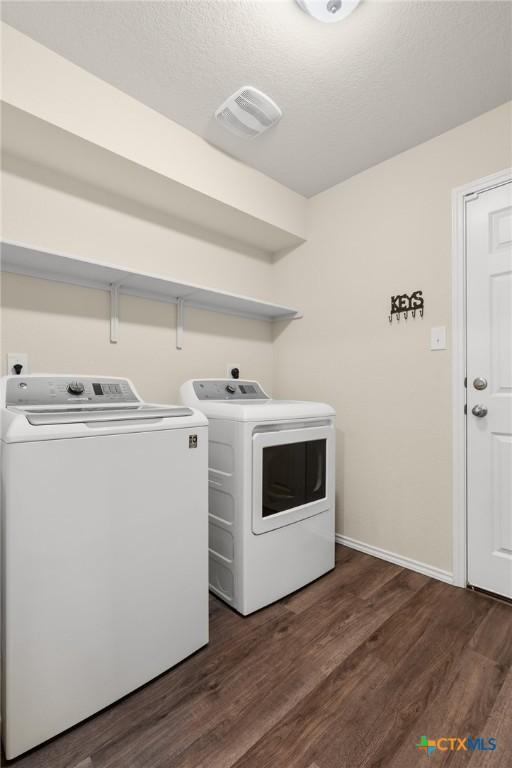 2520 Cortona St, Harker Heights, TX 76548 - laundry area featuring washer and clothes dryer and dark wood-style flooring