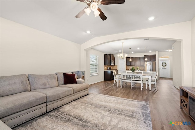 2520 Cortona St, Harker Heights, TX 76548 - living area with arched walkways, wood finished floors, ceiling fan, recessed lighting, and a chandelier
