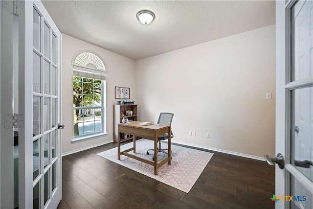 office featuring french doors, dark wood finished floors, a textured ceiling, and baseboards