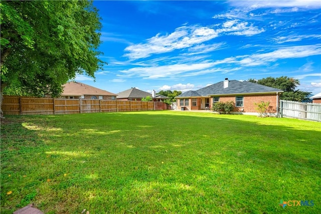 view of yard featuring a fenced backyard