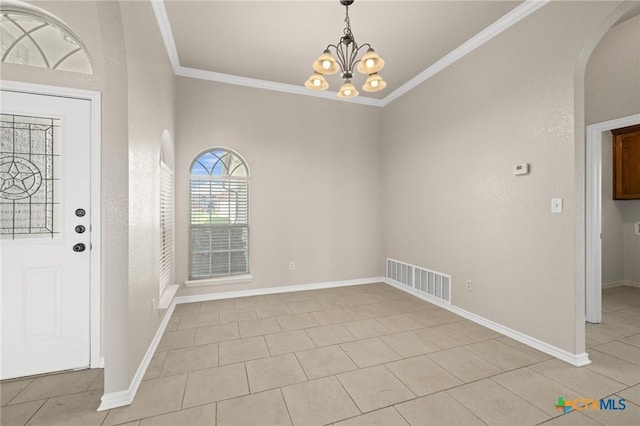 5620 Drystone Ln, Killeen, TX 76542 - foyer entrance with arched walkways, a chandelier, ornamental molding, baseboards, and light tile patterned floors