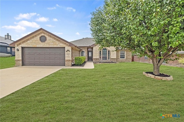 5620 Drystone Ln, Killeen, TX 76542 - view of front facade with a garage, concrete driveway, a front lawn, and brick siding