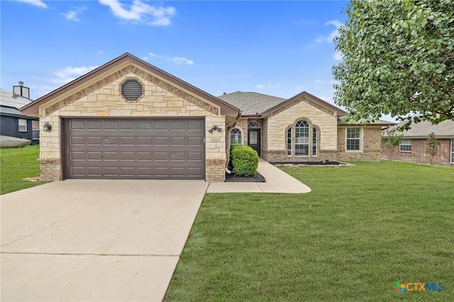 5620 Drystone Ln, Killeen, TX 76542 - view of front of property featuring a front lawn, concrete driveway, a garage, brick siding, and stone siding