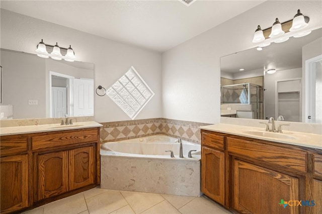5620 Drystone Ln, Killeen, TX 76542 - full bathroom with a shower stall, tile patterned floors, a garden tub, and two vanities