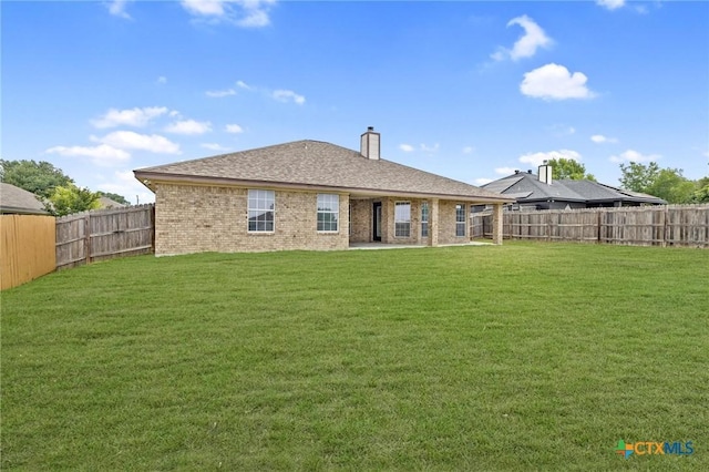 5620 Drystone Ln, Killeen, TX 76542 - rear view of house with brick siding and a chimney
