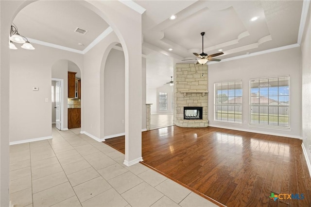 5620 Drystone Ln, Killeen, TX 76542 - unfurnished living room featuring ceiling fan, plenty of natural light, baseboards, light tile patterned flooring, and ornamental molding